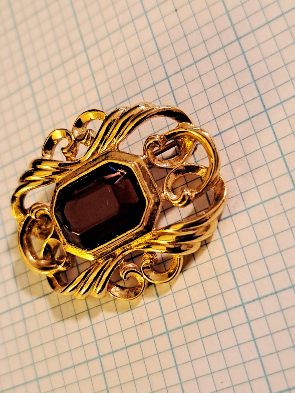 Avon Vintage Gold-Tone Brooch with Deep Garnet Center
